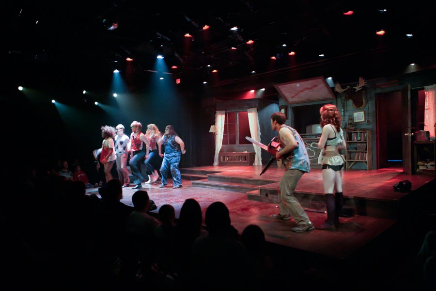 The cast dances and sings "Do The Necronomicon" while Ash (Sam Wright) and Annie (Olivia Marsh) look on.