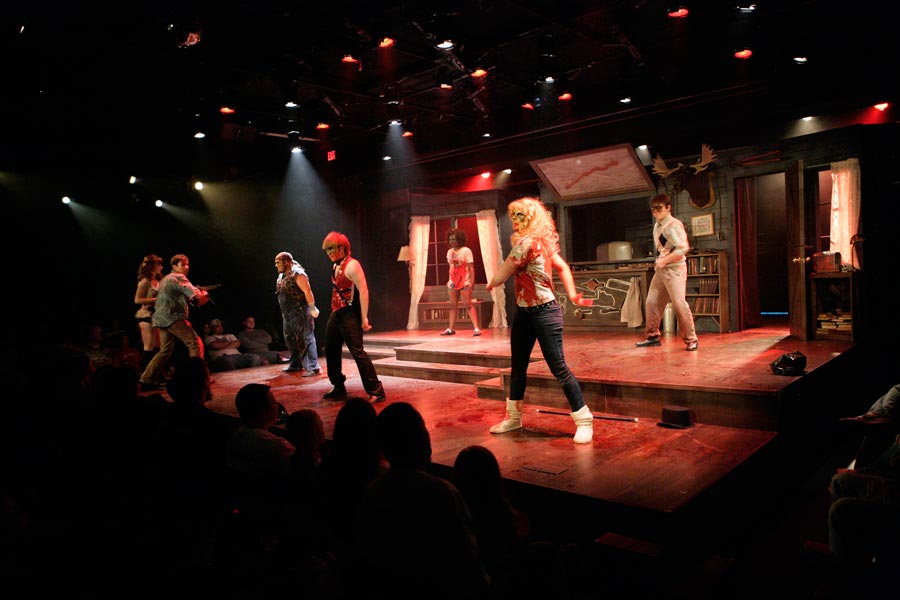 The cast dances and sings "Do The Necronomicon" while Ash (Sam Wright) and Annie (Olivia Marsh) look on.